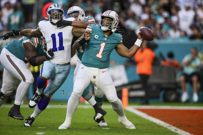 Dec 24, 2023; Miami Gardens, Florida, USA; Miami Dolphins quarterback Tua Tagovailoa (1) throws the football against the Dallas Cowboys during the first quarter at Hard Rock Stadium.